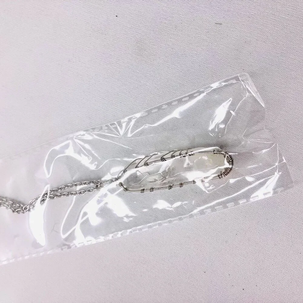 Clinique Geometric Pouch Silver Necklace & Wooden Bracelet Bundle